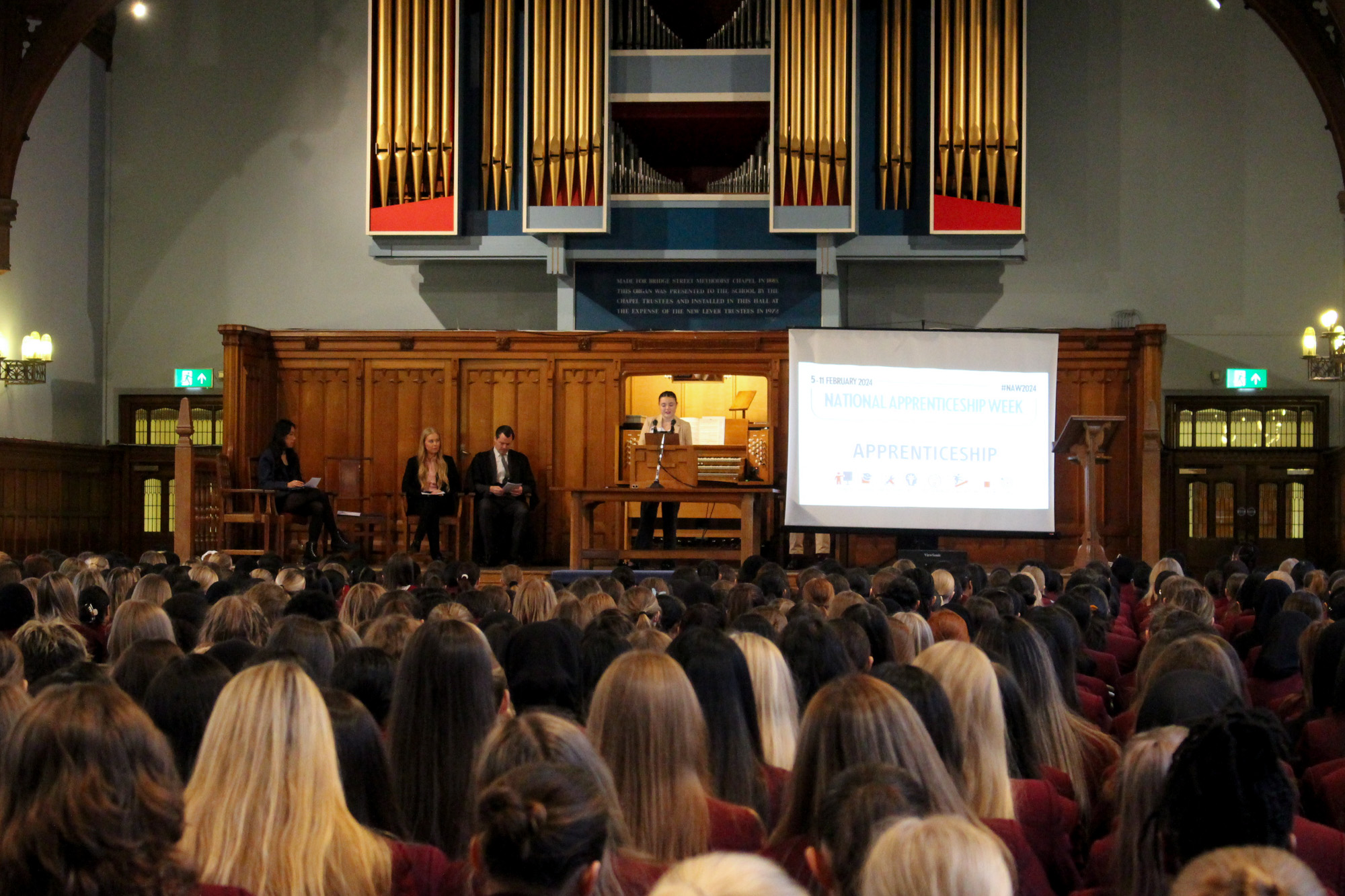 Faye speaking in Girls' Division assembly