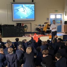 Boys Enthralled by Polar Explorer