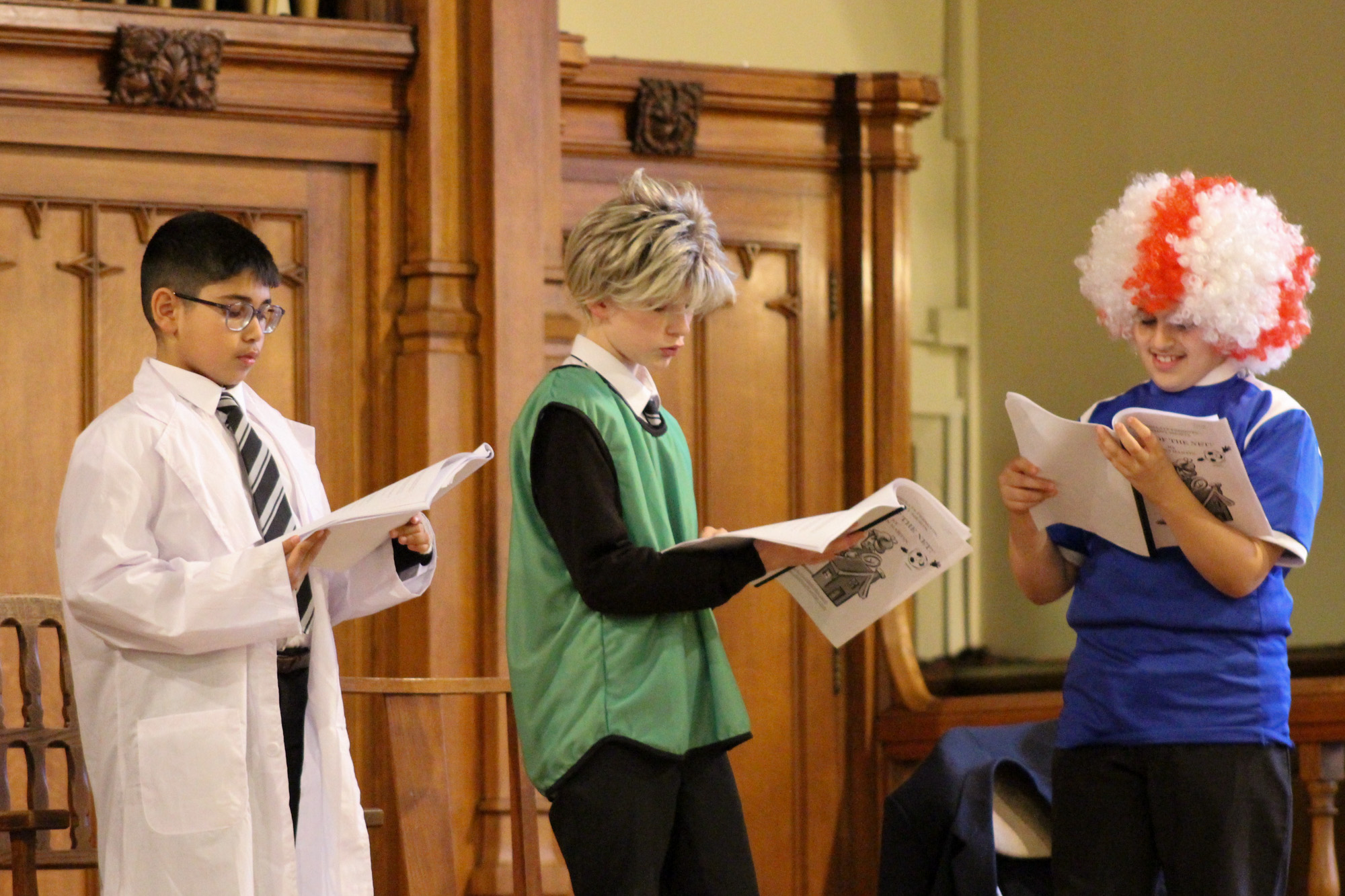 A group of boys performing their parts in the afternoon's mystery