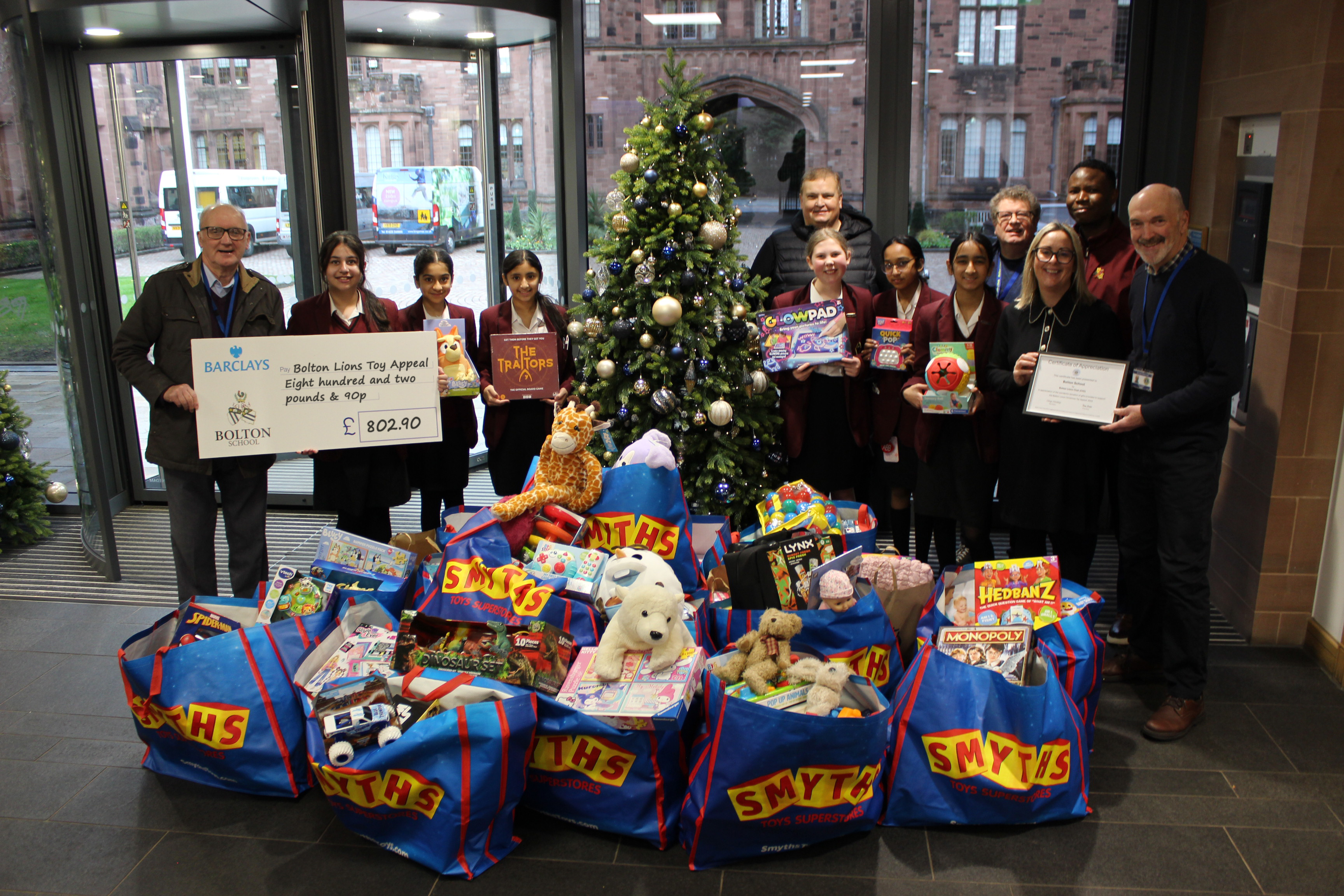 Girls' Sponsored Silence Funds Donation to Bolton Lions Toy Appeal